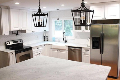 Example of a transitional kitchen design in New York