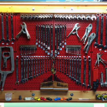 Red Metal Pegboard Meticulously Organized to Perfection