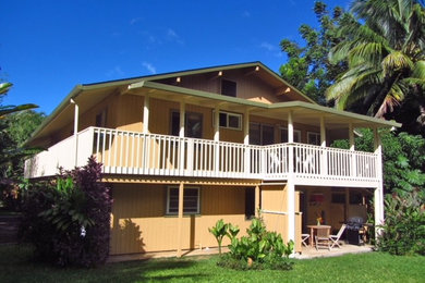 Example of a large classic two-story wood house exterior design in Other