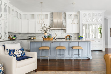 Open concept kitchen - large transitional l-shaped dark wood floor and brown floor open concept kitchen idea in Houston with an undermount sink, recessed-panel cabinets, white cabinets, white backsplash, marble backsplash, an island and gray countertops