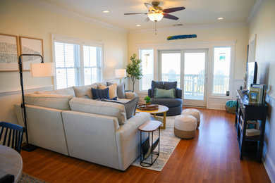 Mid-sized beach style enclosed living room photo in Other with a media wall