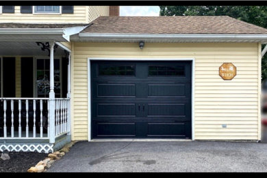 Example of a mid-sized attached one-car garage design in Other