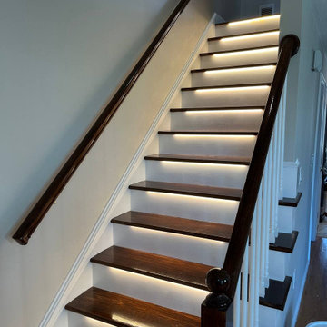 Modern Staircase Transformation with LED Lighting by Sun Shore Construction