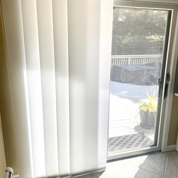 Alta Sleek Gliding Panel Track Shades on a Sliding Glass Door in Kitchen