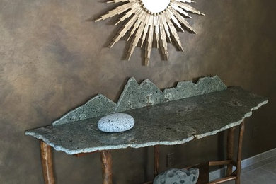 Mid-sized minimalist travertine floor and gray floor enclosed dining room photo in Boise with gray walls