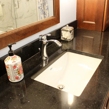 White and Gray MasterBath with Marble Look and Herringbone Tiled Shower