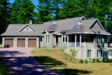 Inspiration for a coastal gray two-story exterior home remodel in Other