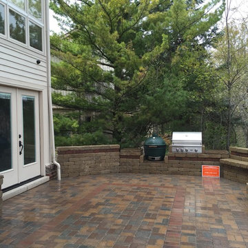 Outdoor Kitchen with  fireplace, dining area and seating wall