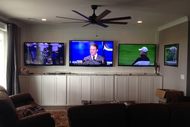 Inspiration for a mid-sized timeless home theater remodel in Charleston