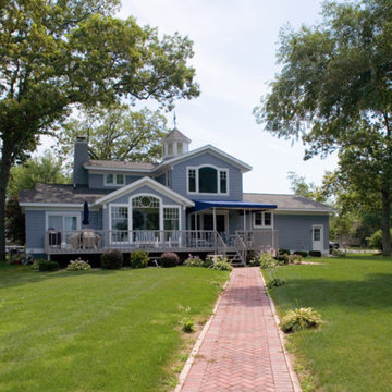 Beautiful Traditional Blue Wooden Siding Suburban Home - White Windows & Frames
