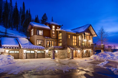 Huge rustic brown three-story mixed siding exterior home idea in Denver