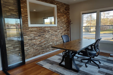 Inspiration for a small rustic wood wall home office remodel in Miami
