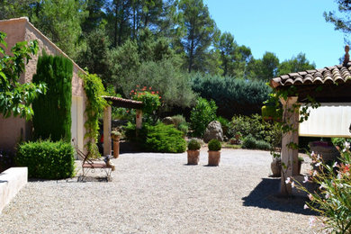 Photo of a huge french country full sun backyard gravel formal garden in New York with a pergola for summer.