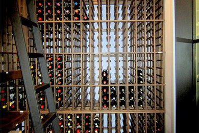 Wine cellar - mid-sized transitional wine cellar idea in Dallas