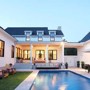 他の地域の長方形カントリー風おしゃれな裏庭プール (コンクリート敷き ) の写真