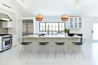 Example of a large minimalist l-shaped linoleum floor open concept kitchen design in New York with an undermount sink, recessed-panel cabinets, white cabinets, granite countertops, brown backsplash, stainless steel appliances and an island