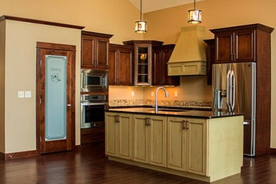 Mountain style kitchen photo in Other with glass-front cabinets, granite countertops and stainless steel appliances