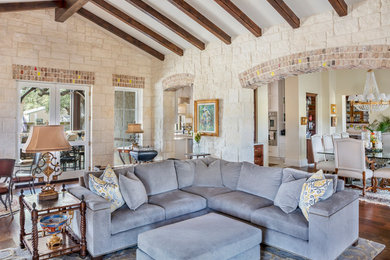 Living room - traditional enclosed dark wood floor and brown floor living room idea in Austin
