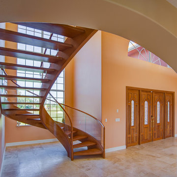 Contemporary Curved Staircase with Glass Railing and Open Risers