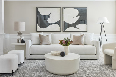 This is an example of a large transitional living room in Toronto with decorative wall panelling.