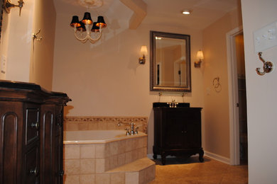 Inspiration for a transitional master bathroom remodel in Other with raised-panel cabinets