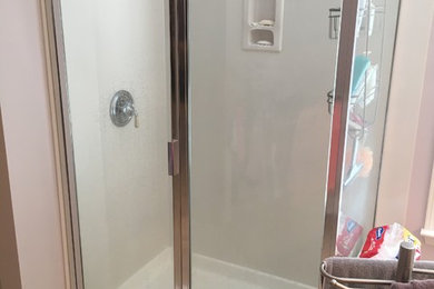 Example of a small arts and crafts master beige tile bathroom design in Charlotte