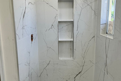 Inspiration for a large modern master white tile and porcelain tile pebble tile floor and white floor wet room remodel in Miami