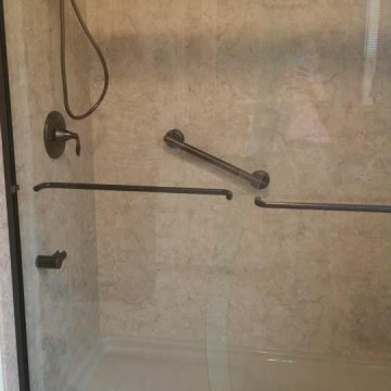 Brecchia smooth shower wall w/ Oil Rub Bronze Fixtures