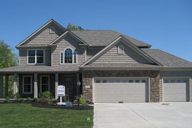 Large gray two-story mixed siding exterior home photo in Cleveland