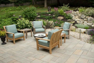 Design ideas for a mid-sized contemporary backyard patio in Portland Maine with concrete pavers.