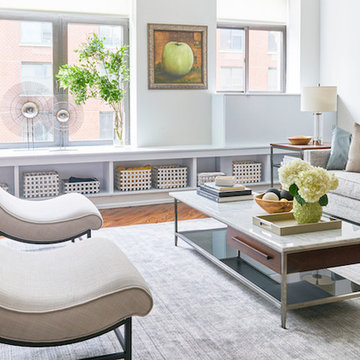 Custom-made slipper chairs bring a needed curve to the living room