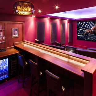 Medium sized contemporary enclosed home cinema in Other with red walls.
