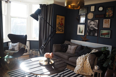 Design ideas for an eclectic living room in Other with blue walls.