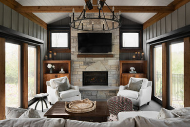 Mountain style porch photo in Milwaukee with a fireplace and a roof extension