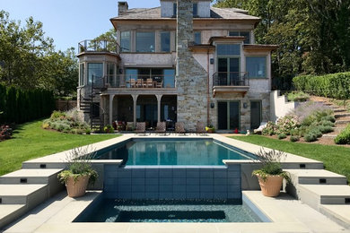 Hot tub - coastal backyard rectangular hot tub idea in Boston