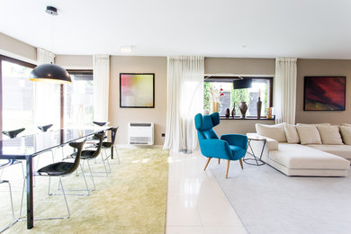 Inspiration for a large eclectic loft-style marble floor and white floor living room remodel in Other with beige walls and a tv stand