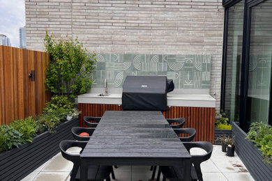 Inspiration for a mid-sized modern concrete paver landscaping in New York.