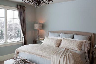 Photo of a traditional bedroom in Other with grey walls.