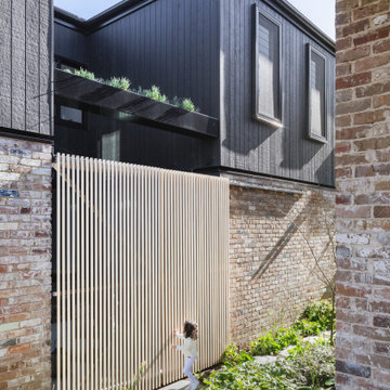 Sustainable House - sliding timber privacy screens