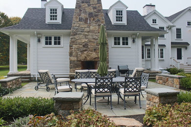 Example of an arts and crafts patio design in Boston