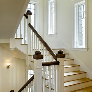 Inspiration for a timeless wooden staircase remodel in Burlington with painted risers
