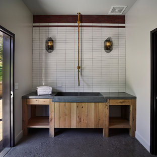 Country utility room in San Francisco with an integrated sink, open cabinets, light wood cabinets, concrete worktops, white walls and grey floors.