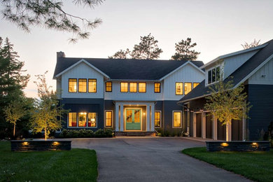 Contemporary two-story concrete fiberboard exterior home idea in Minneapolis with a shingle roof