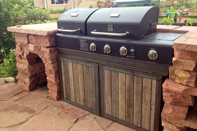 Example of a mountain style patio design in Denver