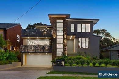 Design ideas for a large contemporary two-storey concrete grey house exterior in Sydney with a flat roof and a metal roof.