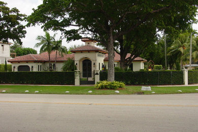 Design ideas for a medium sized mediterranean house exterior in Miami.