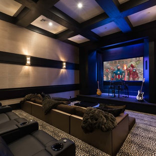 Inspiration for a large contemporary carpeted and multicolored floor home theater remodel in Orlando with beige walls and a media wall