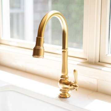 Golden Glow: Elegant Faucet Framed in Natural Light