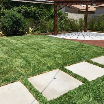 Turf grass with pre-cast pavers to deck beginning.