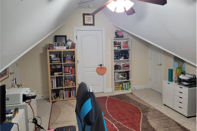 Home office - small eclectic freestanding desk carpeted, beige floor and vaulted ceiling home office idea in Raleigh with beige walls